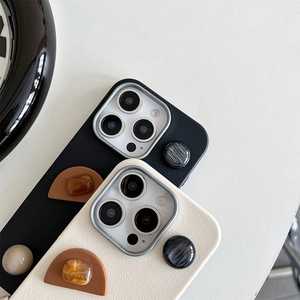 Detail of lychee leather iPhone case with geometric marble and amber stone accents