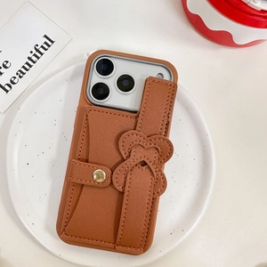 Brown litchi leather iPhone case with card wallet and heart-accented wrist strap