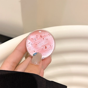 Close-up of pink phone socket with red foil flakes and artistic resin texture