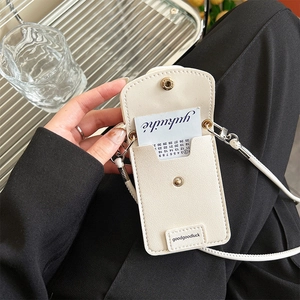 Close-up of cream silicone phone case with built-in card holder and crossbody strap detail