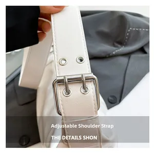 Close-up of adjustable white leather strap with silver buckle and double-hole details