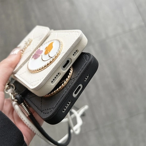 Detail of charging port and speaker cutouts on quilted silicone phone case with wallet
