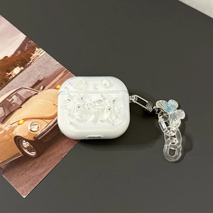 Detail of AirPods case with 3D resin flowers, pearls and iridescent butterfly charm