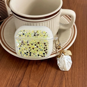 Glittering clear case for AirPods Pro with golden sequins and a pearl shell charm detail