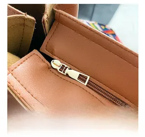 Macro detail of brown leather bag with golden zipper and fine stitching on the inner lining