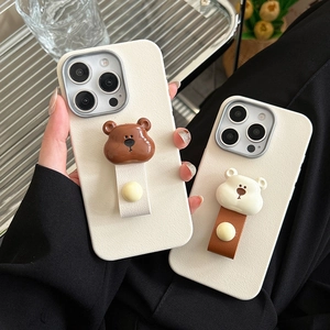 Close-up of leather texture phone case with cute bear ring holder and hand strap