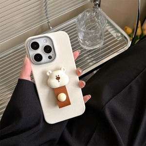 Detail of cream leather-textured iPhone case with cute 3D bear head and hand strap