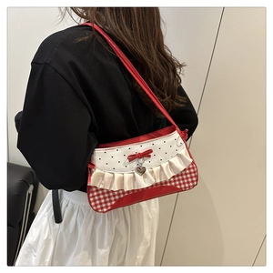 Red and white checkered underarm bag worn by model showing casual back view style