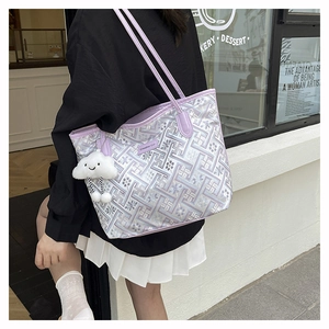 Close-up of lavender woven tote bag featuring a cute white plush cloud charm for students