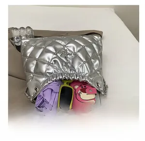 Internal capacity of silver quilted bucket bag showing storage space for daily essentials