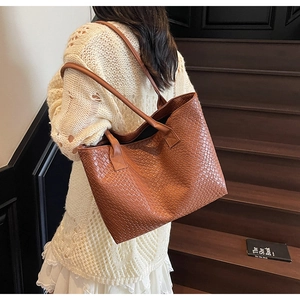 Detailed view of brown woven texture and slim handles on the premium tote bag