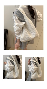 Détails de broderie en dentelle florale blanche et texture ajourée sur un cabas