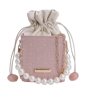 Pink drawstring bucket bag with pearl handle and metal chain for women's crossbody wear