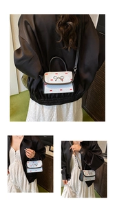 Detailed views of a white checkered mini bag with red bows and black leather trim