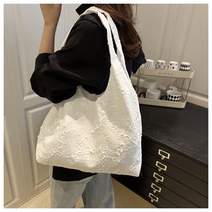 White embroidered floral tote bag for women showing spacious interior and strap detail