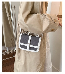 Detail of vintage square crossbody bag in grey canvas with white leather trim