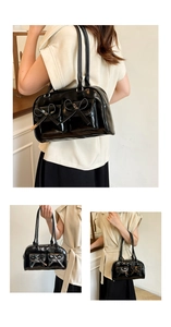 Three views of a black glossy underarm bag with pockets and cute bow details