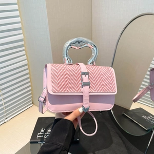 Pink leather and woven flap handbag with artistic silver handle and crossbody strap