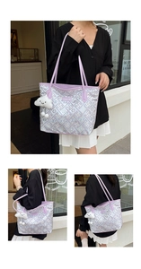 Detail of light purple tote bag with geometric pattern, branded label and cloud charm