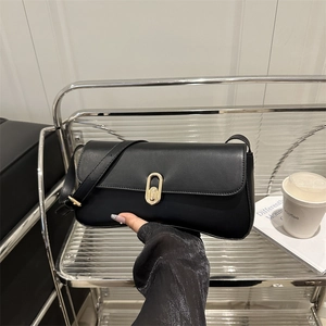 Classic black PU leather underarm bag with gold oval clasp and adjustable shoulder strap