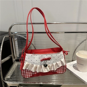 Red plaid baguette shoulder bag with heart pattern and white lace trim detail
