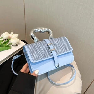 Minimalist light blue square handbag with chic silver metal handle and patterned flap