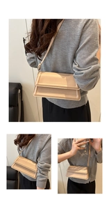 Detail view of apricot faux leather crossbody bag with padded frame and adjustable strap