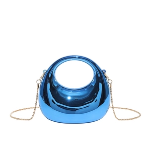 Electric blue crescent moon clutch bag with glossy mirror finish and gold chain strap