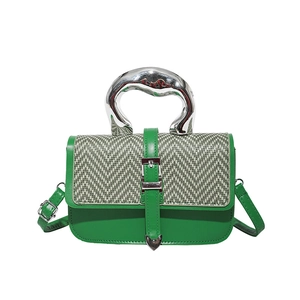Green leather handbag with herringbone flap and artistic silver metal handle for women