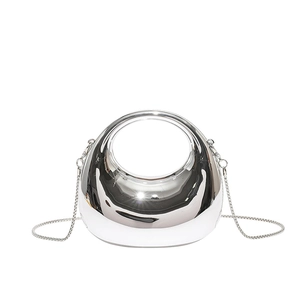 Silver mirror moon bag with hollow ring handle and sleek metal shoulder chain