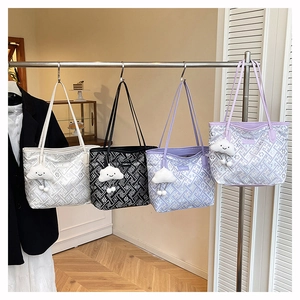 Detail view of large capacity tote bags in four colors with fluffy cloud charms