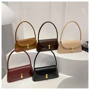 Minimalist vintage baguette bags shown in five colors with sleek gold metal twist locks