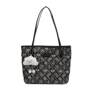 Fashionable large tote bag with silver geometric patterns and plush cloud charm decor