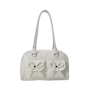 White PU leather ballet-style shoulder bag with decorative bows and double front pockets