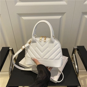 White V-quilted shell handbag with gold hardware and adjustable strap for women