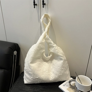 Minimalist white canvas knot bag with floral embroidery and large capacity tote style