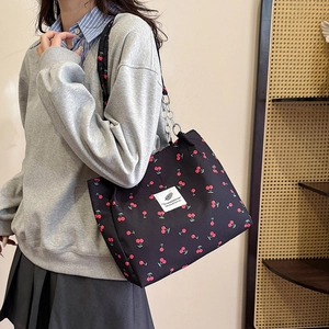 Chic cherry print tote bag for women with black canvas finish and metal chain straps
