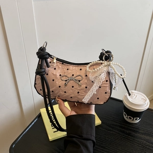 Pink heart print shoulder bag with silver bow and pearl lace pendant detailing
