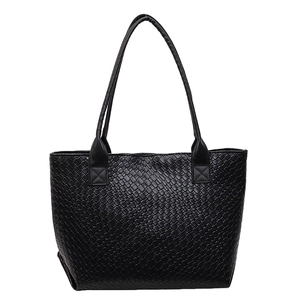 Minimalist black woven tote bag with premium texture and long shoulder straps for daily commute
