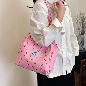 Pink tote bag with red cherry prints and shoulder strap for spring 2025 fashion