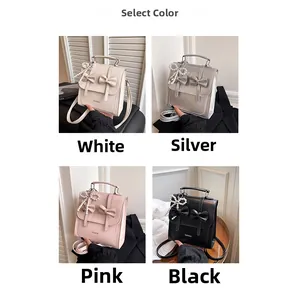Detail view of four-color PU leather backpacks with bows and pearl charms
