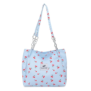 Chic light blue cherry print tote bag with stylish silver chain shoulder strap