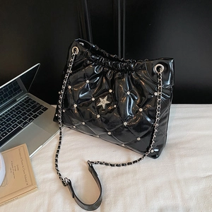 Quilted black patent leather bucket bag with rhinestone star and silver chain strap