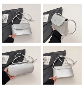Detailed views of a silver bow handbag from front, side, back and bottom angles
