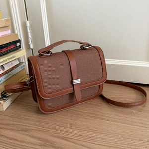 Brown vintage leather and fabric crossbody bag with adjustable strap for casual wear