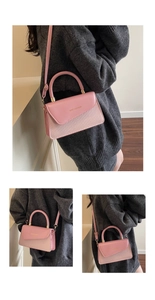 Détail de la sacoche rose avec texture tressée et lettrage doré de mode sur le rabat