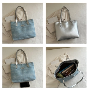Detail view of large tote bag interior and capacity in denim blue and silver