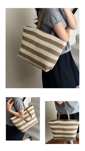 Close-up of woven straw tote bag featuring brown stripes and durable faux leather straps