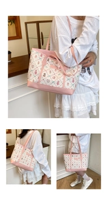 Detail of printed fabric texture and pink leather handle on a sweet cartoon tote bag