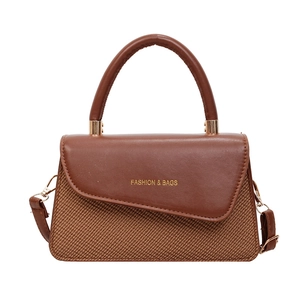 Elegant dark brown structured small flap bag with top handle and crossbody strap